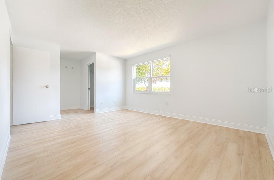 247 South McMullen Booth Road, Unit 23 Clearwater, FL 33759 - Photo 15 of 47 an empty room with windows and closet