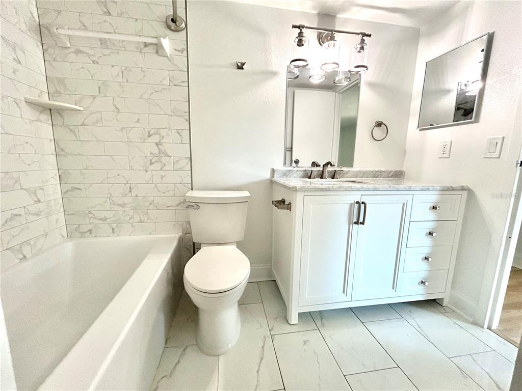 247 South McMullen Booth Road, Unit 23 Clearwater, FL 33759 - Photo 28 of 47 a bathroom with a sink toilet and shower