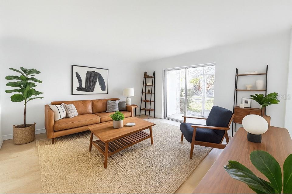 247 South McMullen Booth Road, Unit 23 Clearwater, FL 33759 - Photo 3 of 47 a living room with furniture and a large window