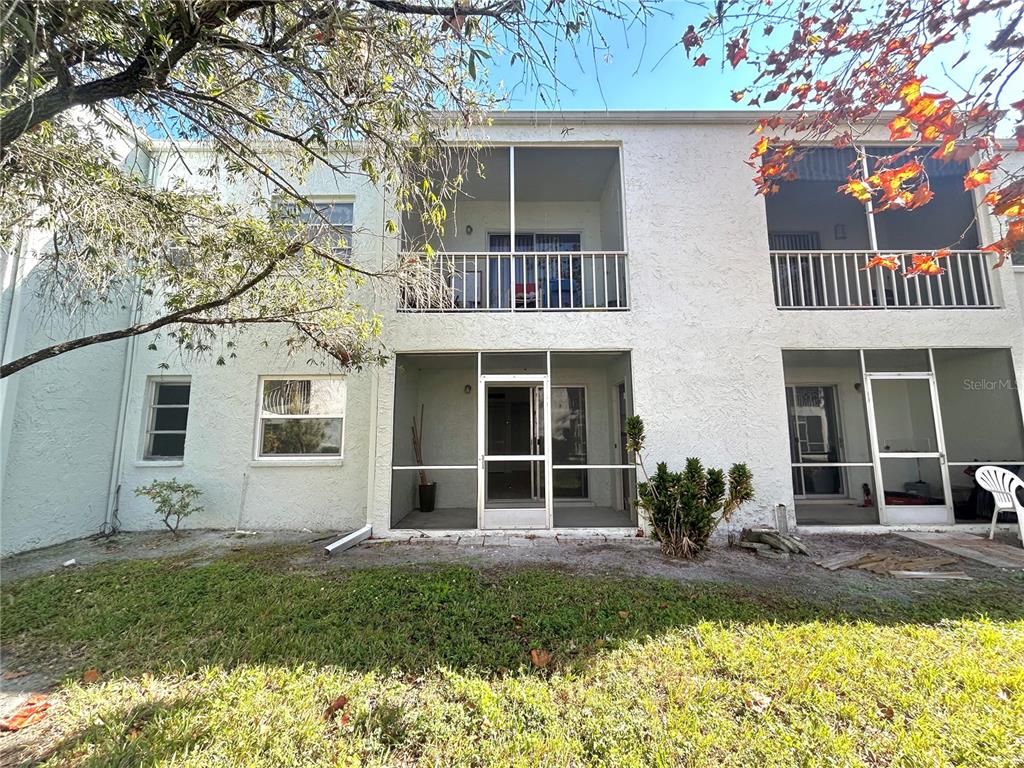 247 South McMullen Booth Road, Unit 23 Clearwater, FL 33759 - Photo 33 of 47 front view of a house with a yard