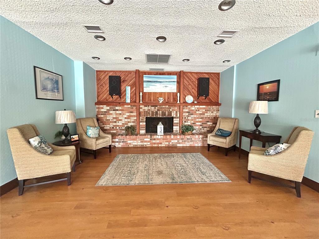 247 South McMullen Booth Road, Unit 23 Clearwater, FL 33759 - Photo 38 of 47 a living room with furniture and a fireplace