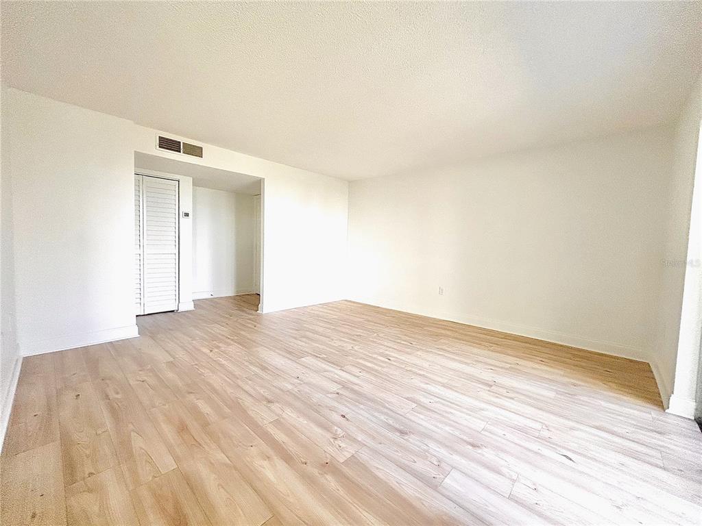 247 South McMullen Booth Road, Unit 23 Clearwater, FL 33759 - Photo 9 of 47 a view of empty room with wooden floor