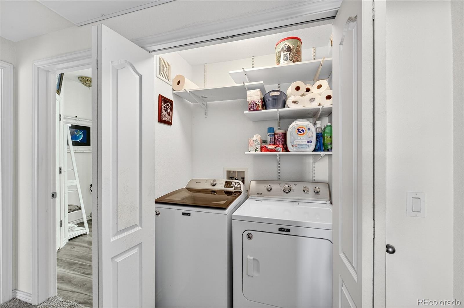 18611 Stroh Road, Unit 5203 Parker, CO 80134 - Photo 12 of 24 a utility room with fridge dryer and washer