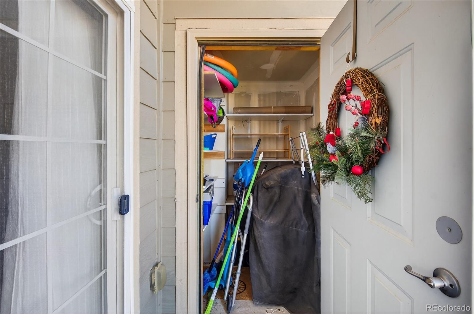 18611 Stroh Road, Unit 5203 Parker, CO 80134 - Photo 14 of 24 a view of walk in closet with clothes and shoes