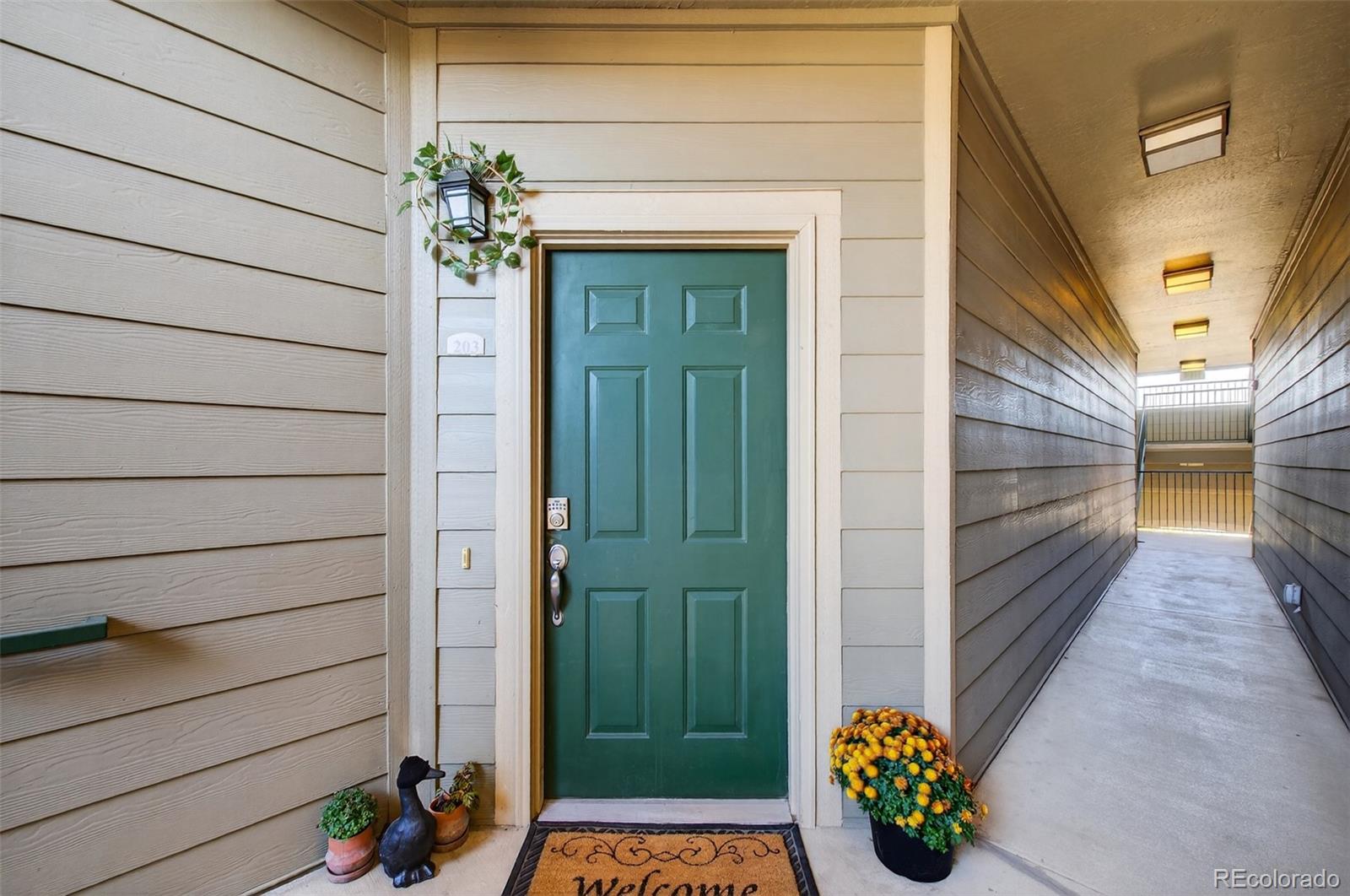 18611 Stroh Road, Unit 5203 Parker, CO 80134 - Photo 15 of 24 a view of a porch with a potted plant