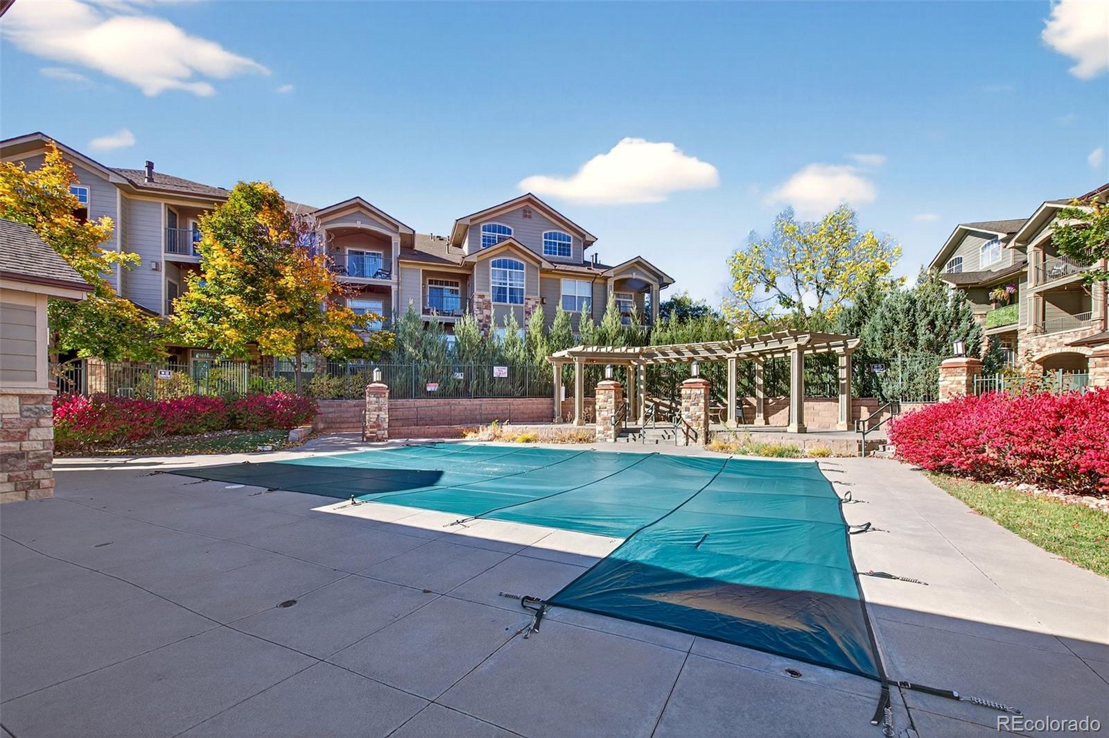18611 Stroh Road, Unit 5203 Parker, CO 80134 - Photo 19 of 24 a front view of a house with a yard and a garden
