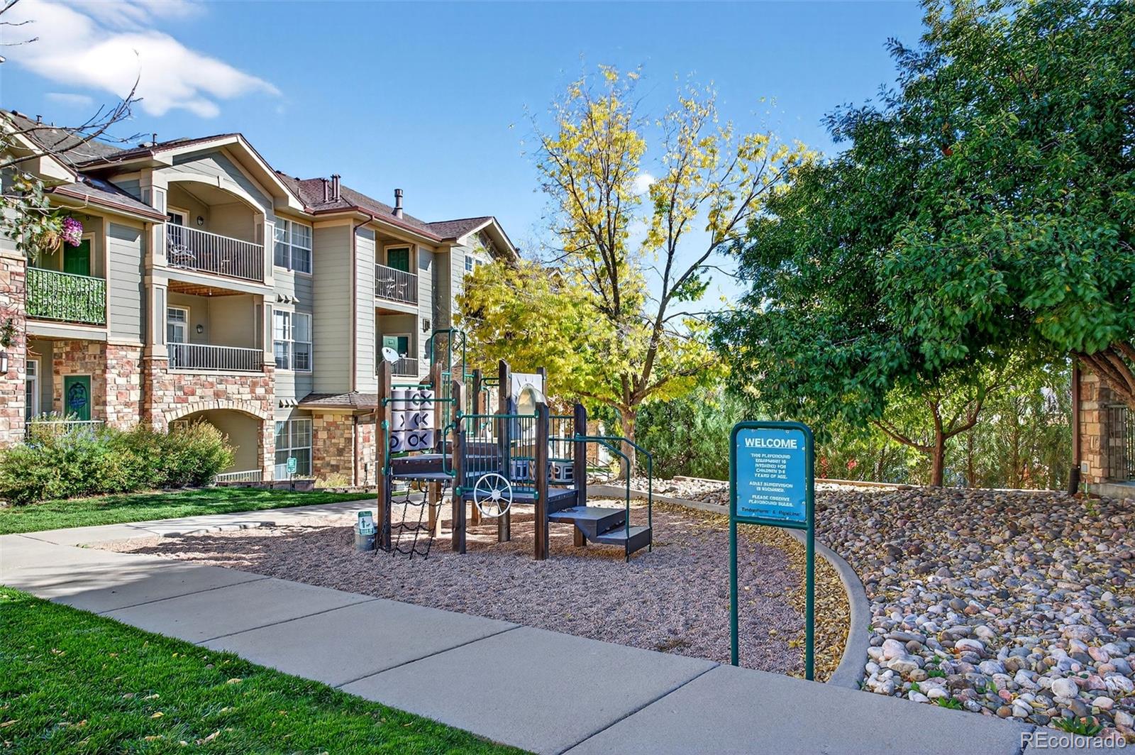 18611 Stroh Road, Unit 5203 Parker, CO 80134 - Photo 21 of 24 a front view of a house with a tree