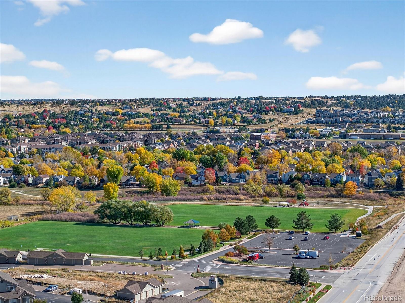 18611 Stroh Road, Unit 5203 Parker, CO 80134 - Photo 23 of 24 an aerial view of a city with lots of residential buildings and mountain view in back