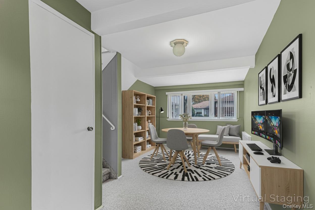 2 Deer Path Lane Syosset, NY 11791 - Photo 19 of 41 a living room with furniture a flat screen tv and a refrigerator