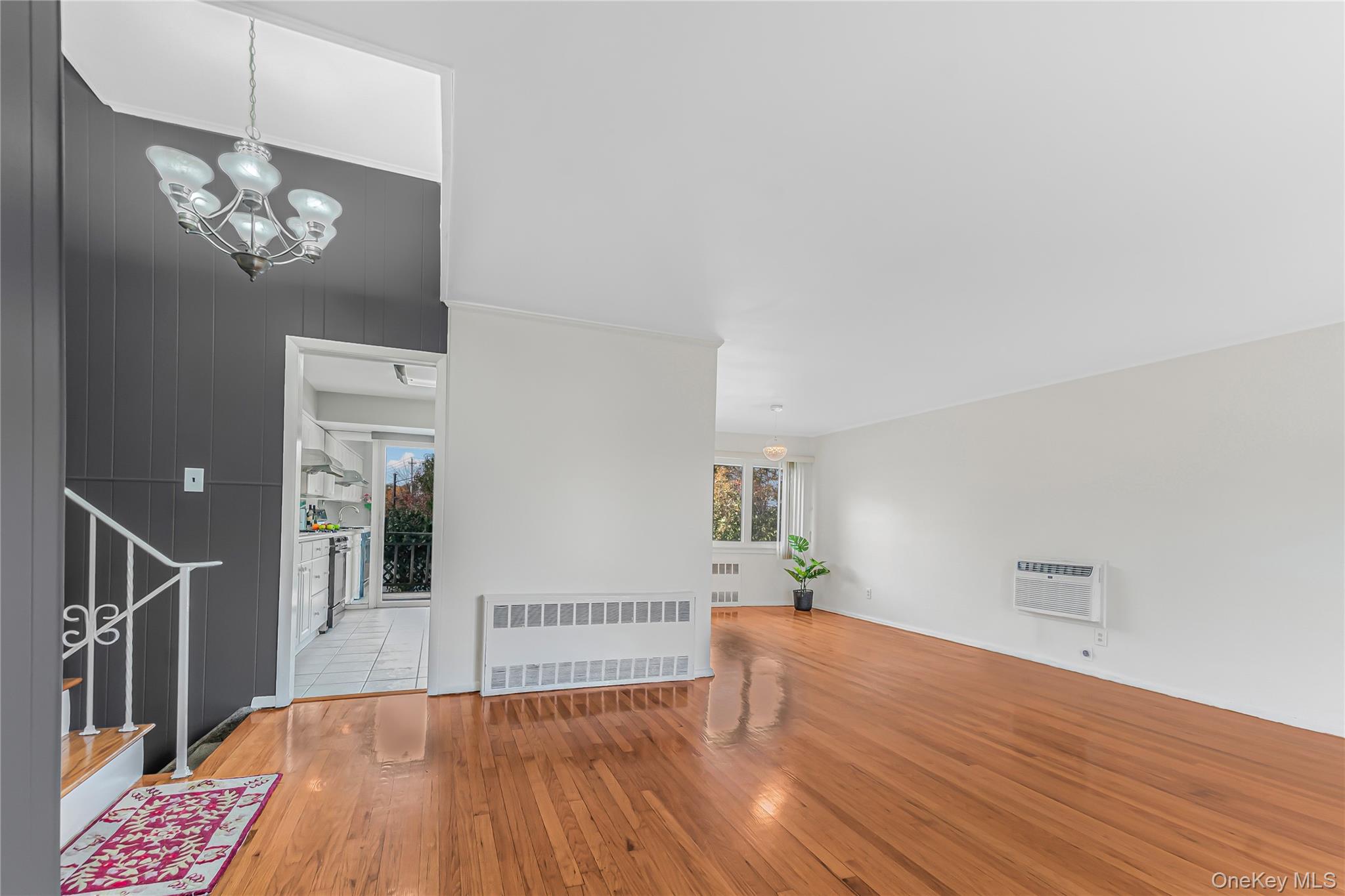 2 Deer Path Lane Syosset, NY 11791 - Photo 2 of 41 a view of livingroom with hardwood floor and kitchen view