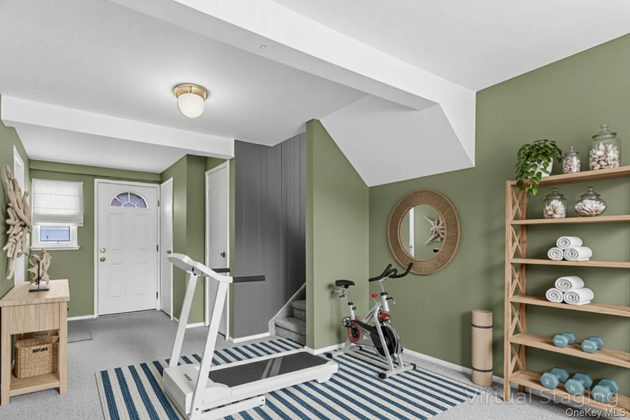 2 Deer Path Lane Syosset, NY 11791 - Photo 21 of 41 a view of a livingroom with furniture and wooden floor
