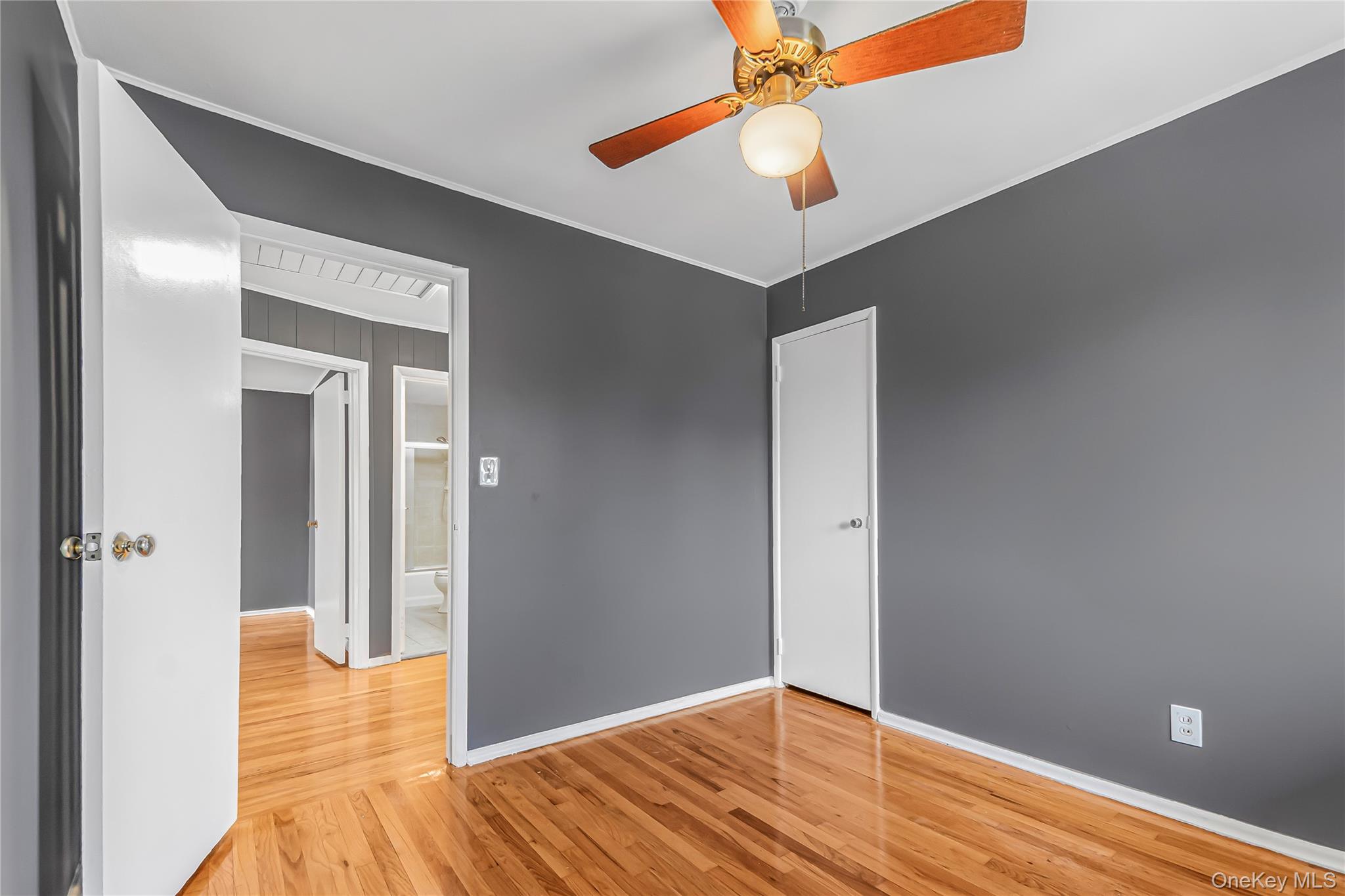 2 Deer Path Lane Syosset, NY 11791 - Photo 24 of 41 wooden floor in an empty room with a window