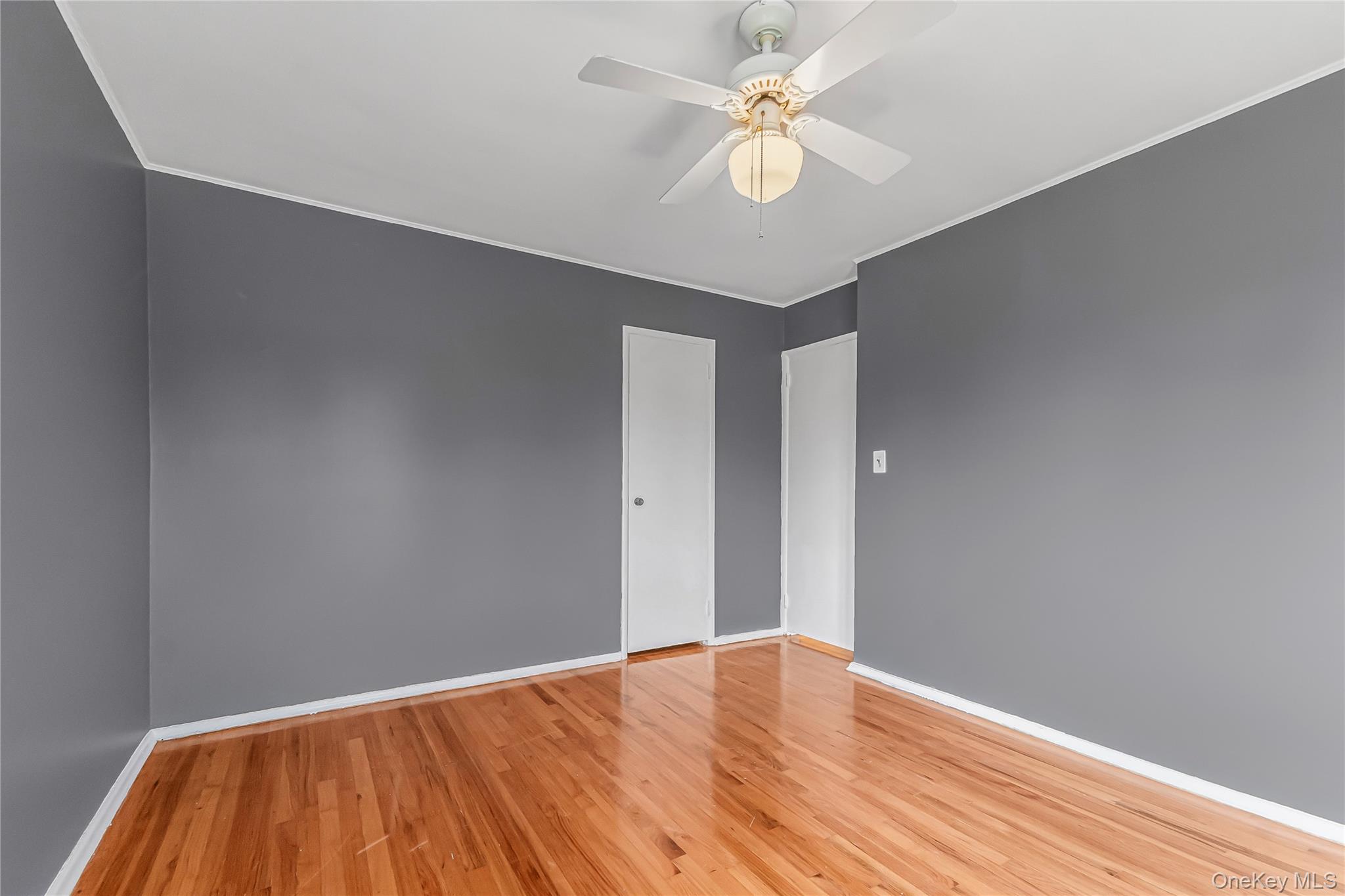 2 Deer Path Lane Syosset, NY 11791 - Photo 27 of 41 a view of empty room with wooden floor