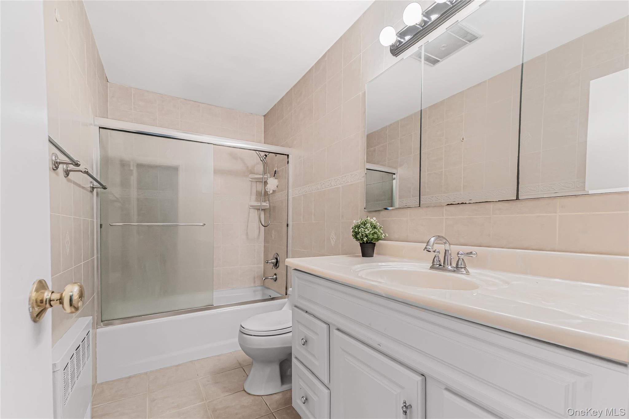 2 Deer Path Lane Syosset, NY 11791 - Photo 32 of 41 a bathroom with a sink a toilet and shower