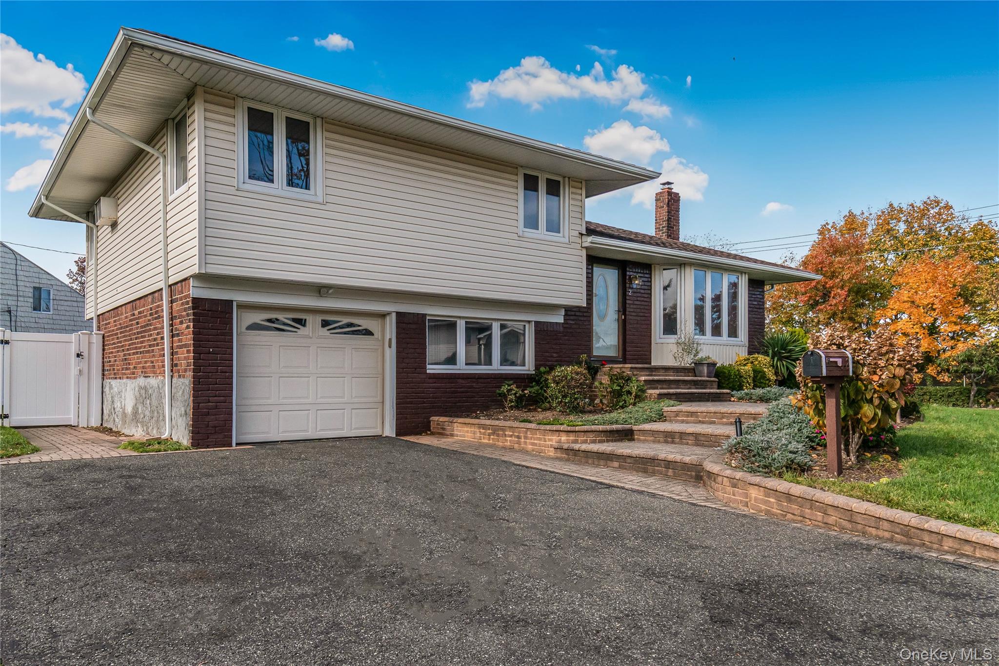 2 Deer Path Lane Syosset, NY 11791 - Photo 39 of 41 a view of a house with a patio