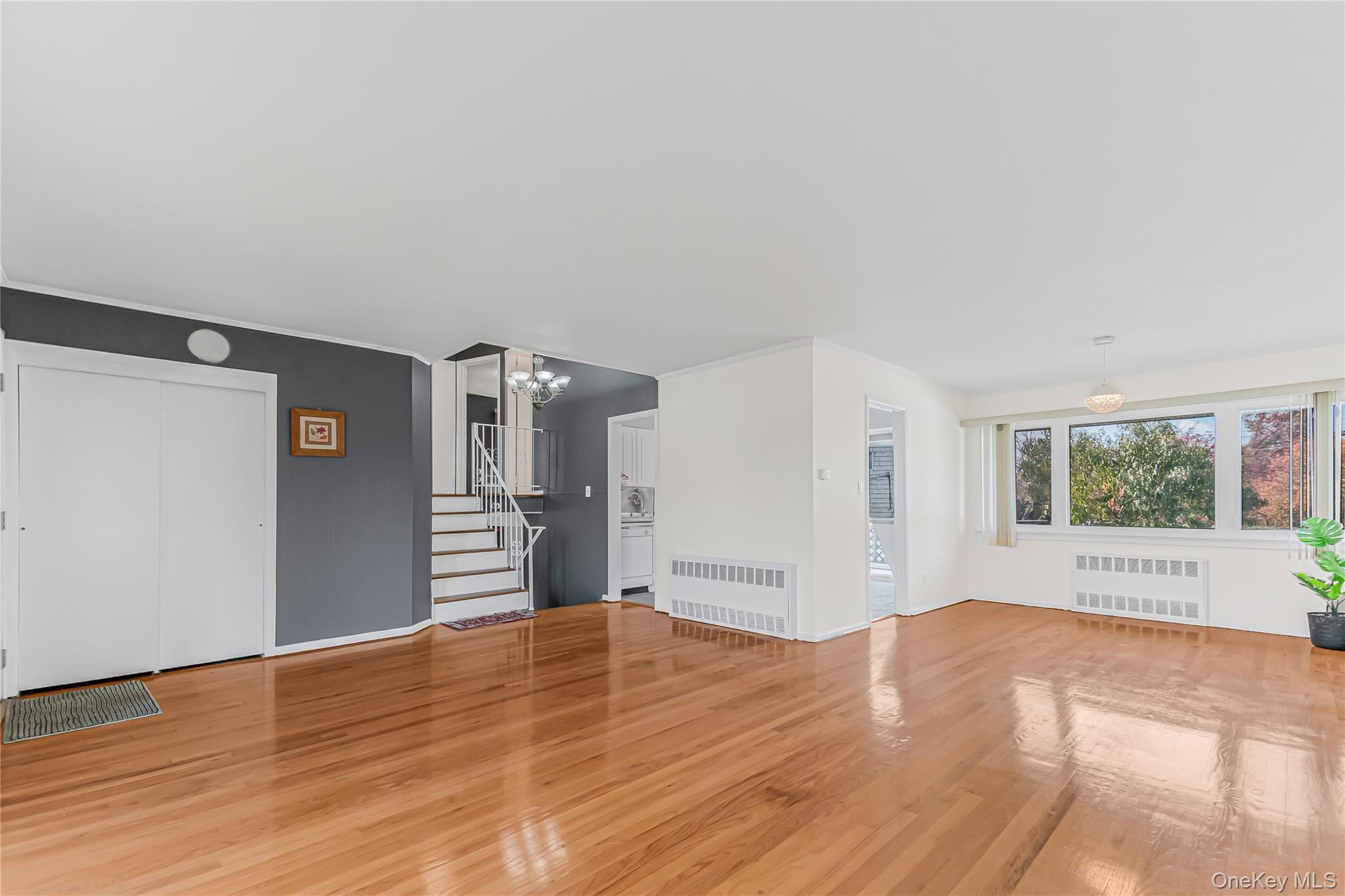 2 Deer Path Lane Syosset, NY 11791 - Photo 4 of 41 a view of empty room with wooden floor