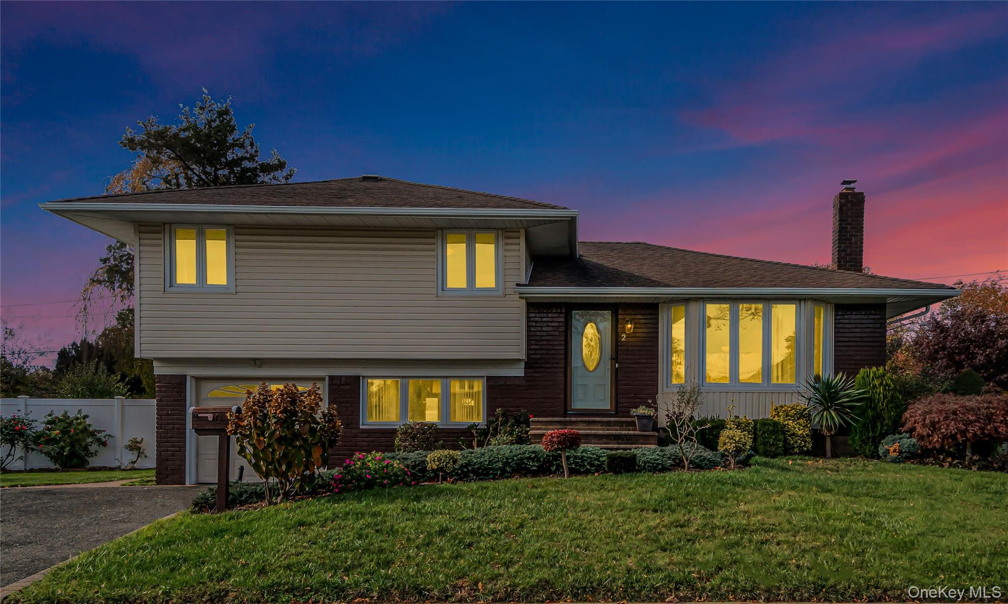 2 Deer Path Lane Syosset, NY 11791 - Photo 41 of 41 a front view of a house with a yard