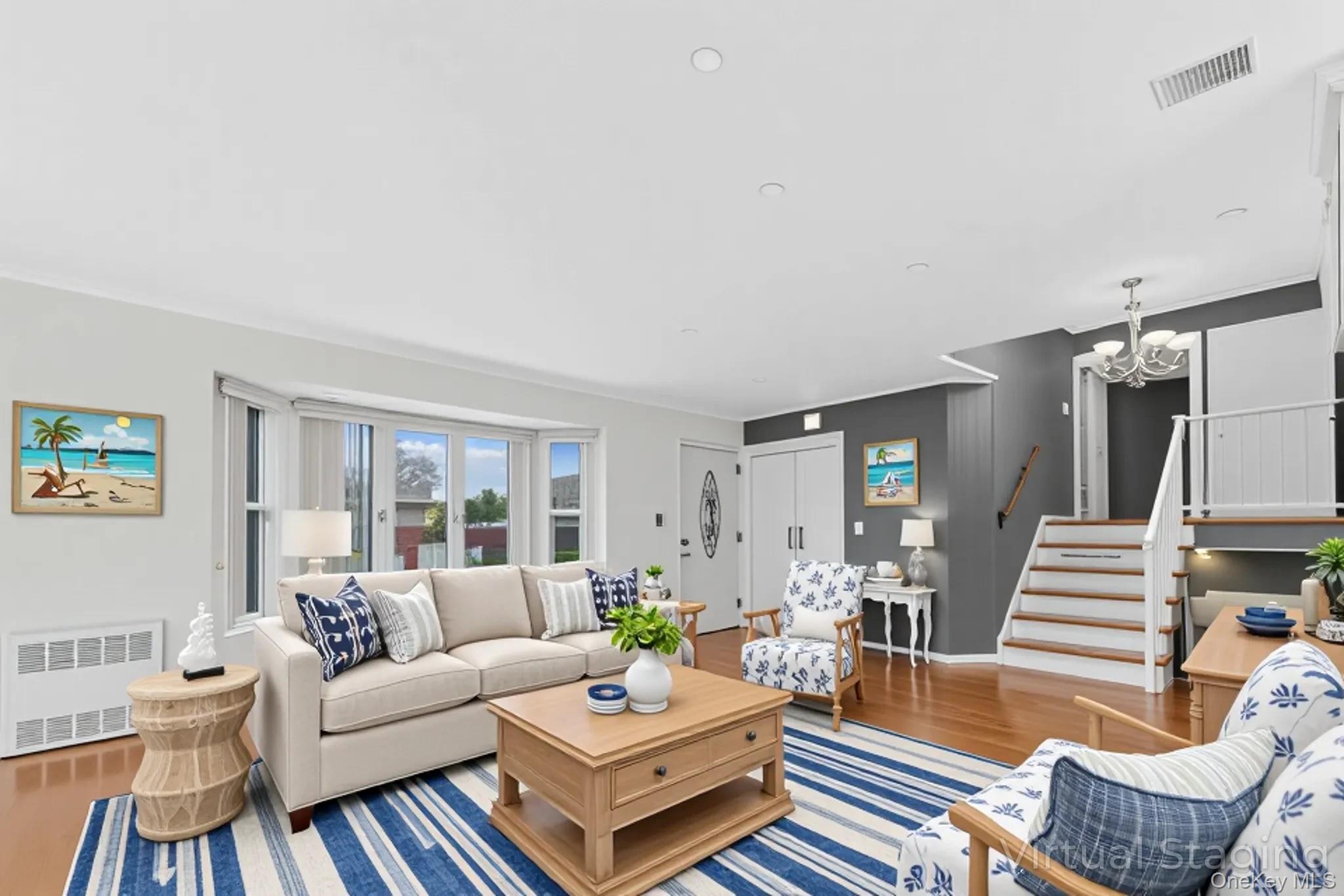 2 Deer Path Lane Syosset, NY 11791 - Photo 7 of 41 a living room with furniture or couch and a wooden floor