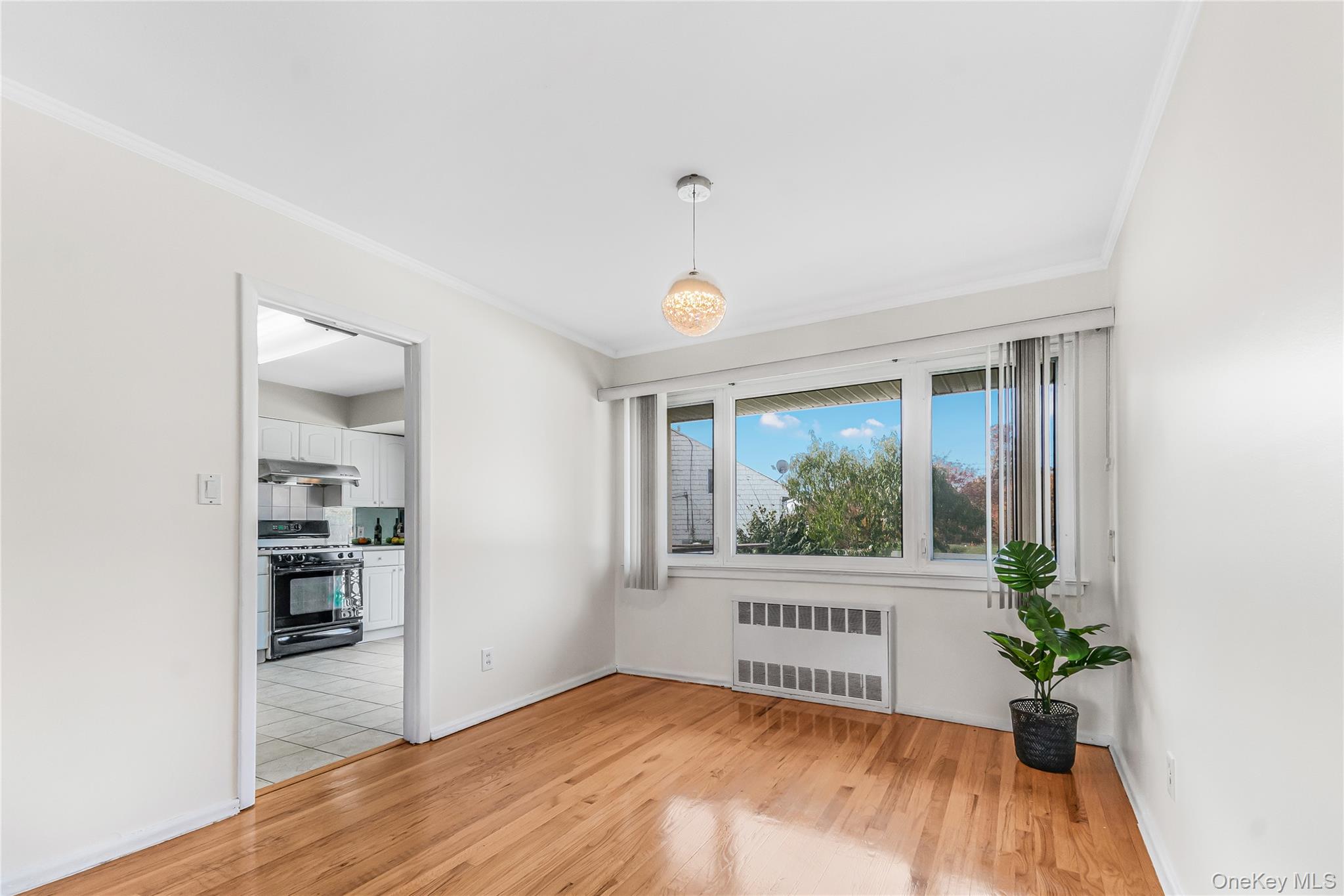 2 Deer Path Lane Syosset, NY 11791 - Photo 8 of 41 a bedroom with a bed and a window