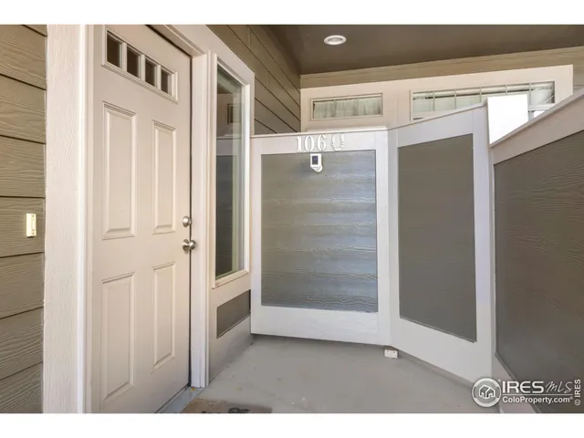 a view of an entryway with wooden door