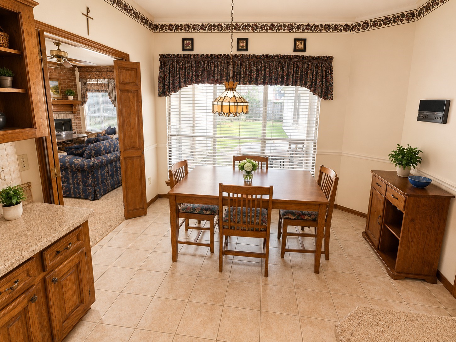 5518 Lacreek Lane Spring, TX 77379 - Photo 7 of 29 BREAKFAST ROOM - Alternate view highlights the generous breakfast area with abundant natural light, tile flooring, charming pendant lighting, and an open connection to the family room and kitchen.