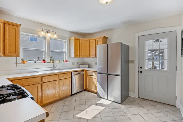a kitchen with a sink stove and microwave