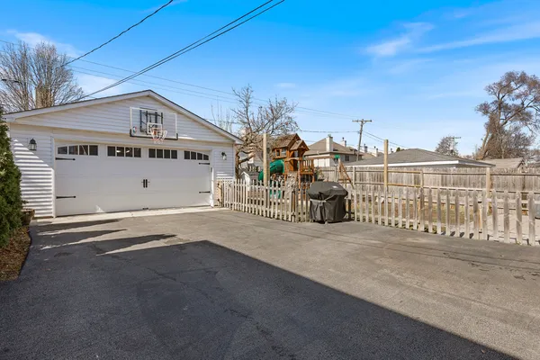a picture of a bench in front of a building