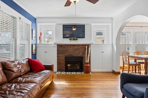 a view of a dining room with furniture and wooden floor