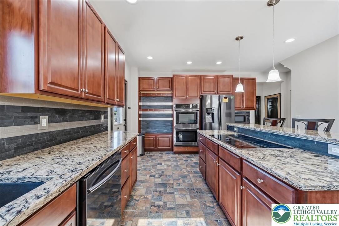 3453 Main Street Slatington, PA 18080 - Photo 8 of 30 Culinary delights await in this chef-inspired kitchen, featuring gleaming countertops and premium appliances.