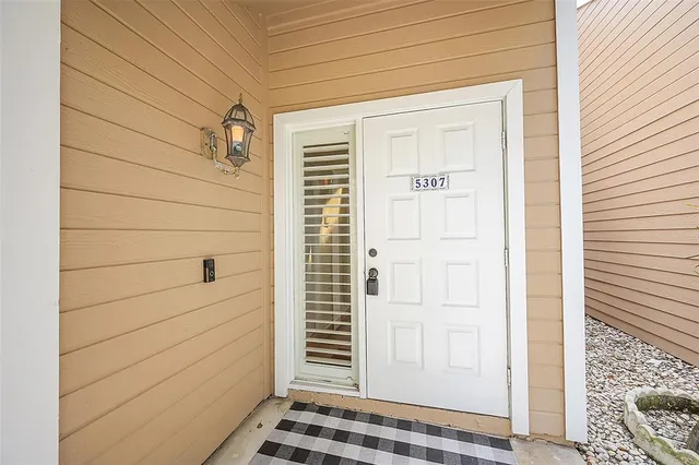 a view of a door and a window