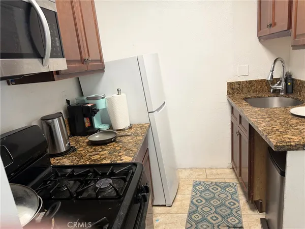 a kitchen with a stove and a sink