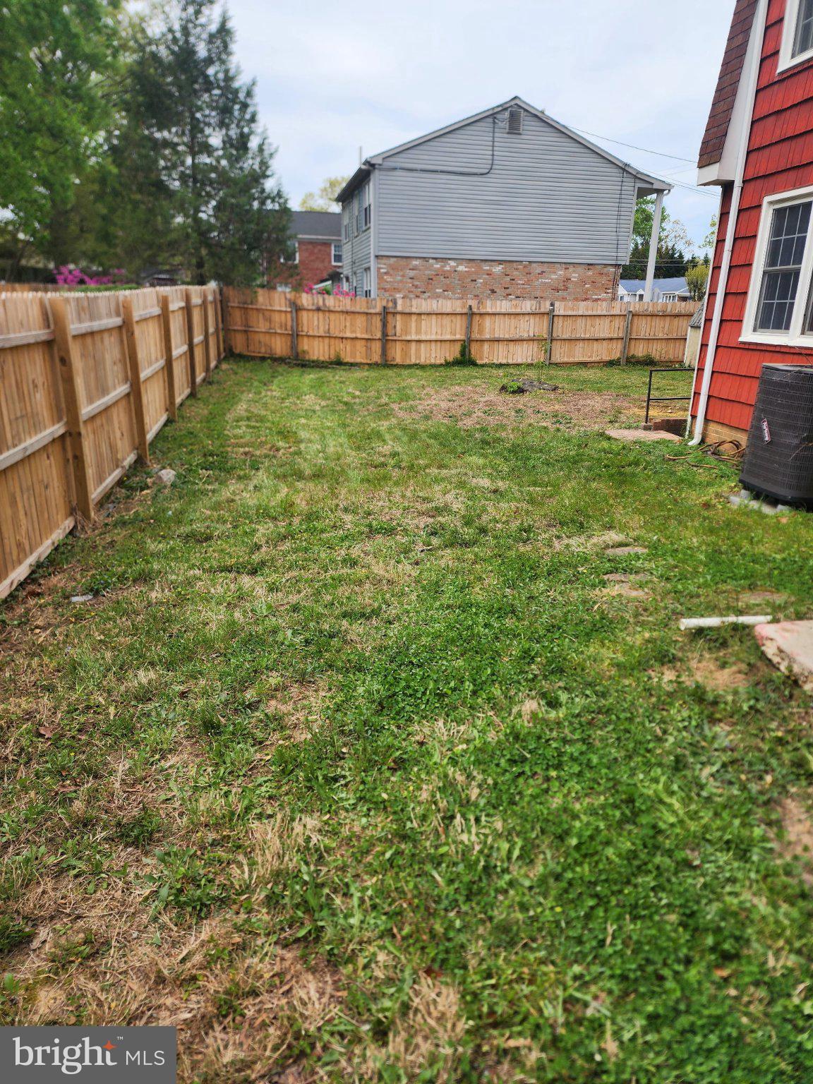 9401 Pine View Lane Clinton, MD 20735 - Photo 15 of 15 a backyard of a house with lots of green space