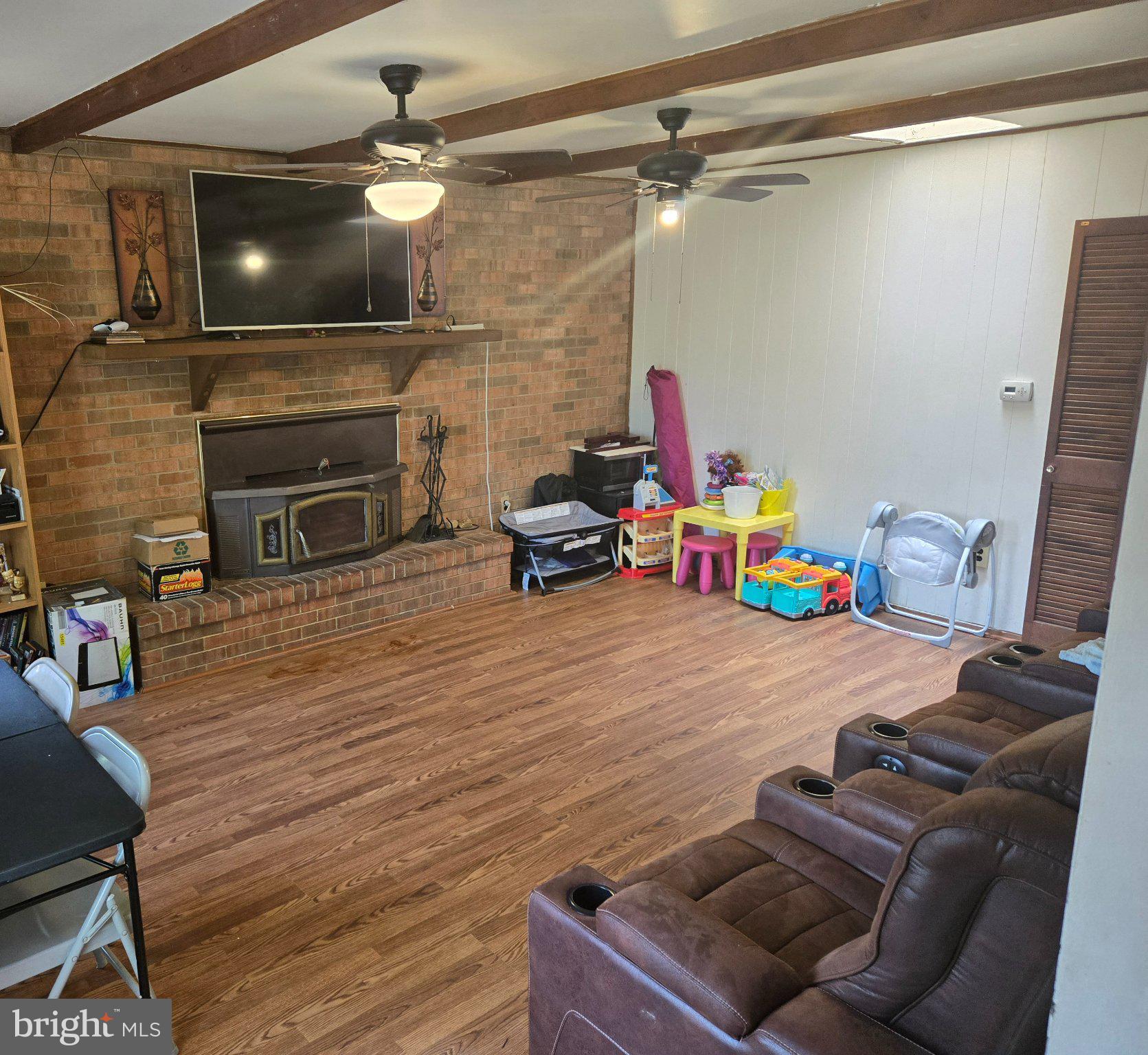 9401 Pine View Lane Clinton, MD 20735 - Photo 3 of 15 a room with furniture and a flat screen tv