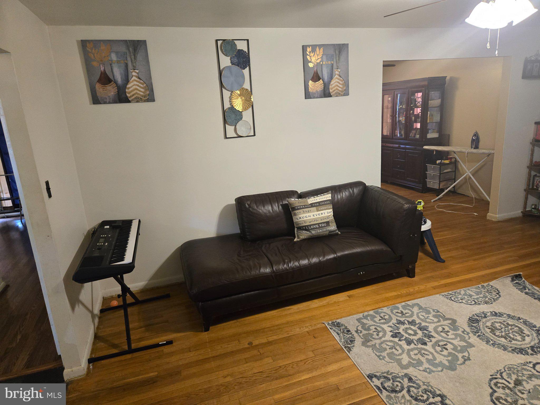 9401 Pine View Lane Clinton, MD 20735 - Photo 4 of 15 a living room with furniture and a rug