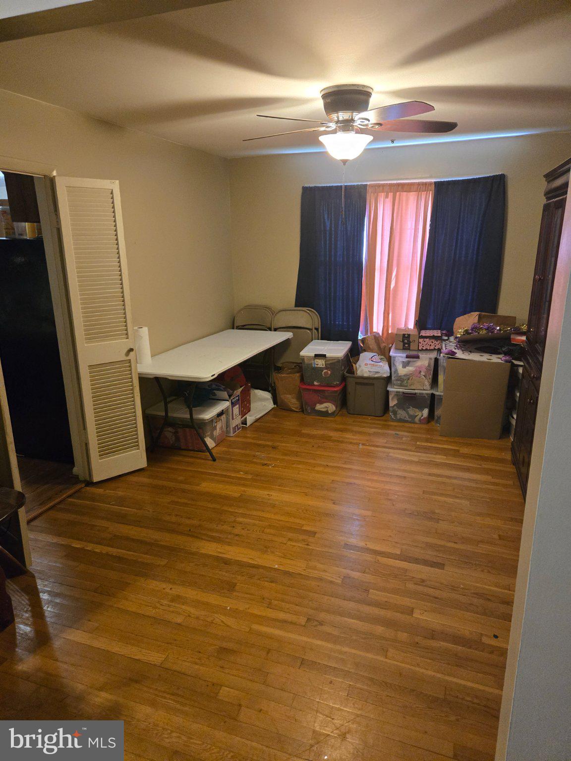 9401 Pine View Lane Clinton, MD 20735 - Photo 5 of 15 a room with wooden floor and furniture