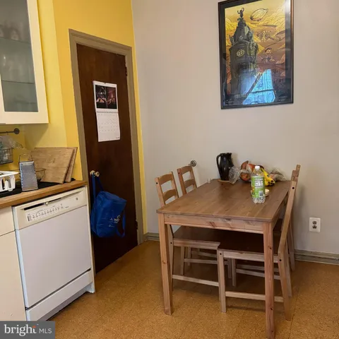 a dining room with a table and chairs