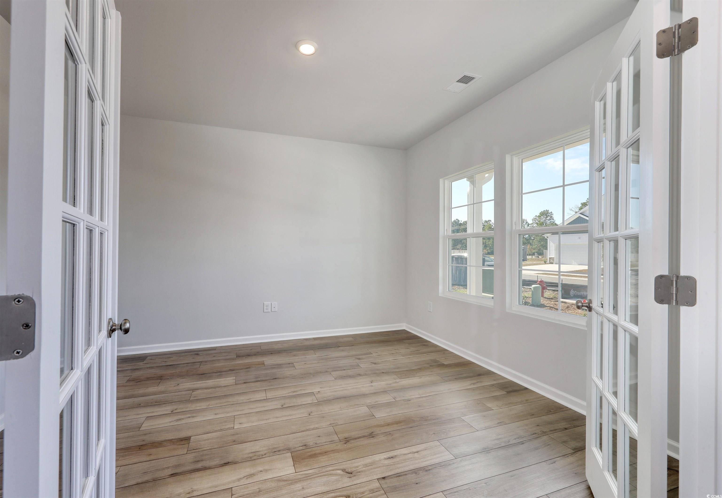 712 St Albans Loop Conway, SC 29526 - Photo 15 of 39 Unfurnished room with french doors and light wood-