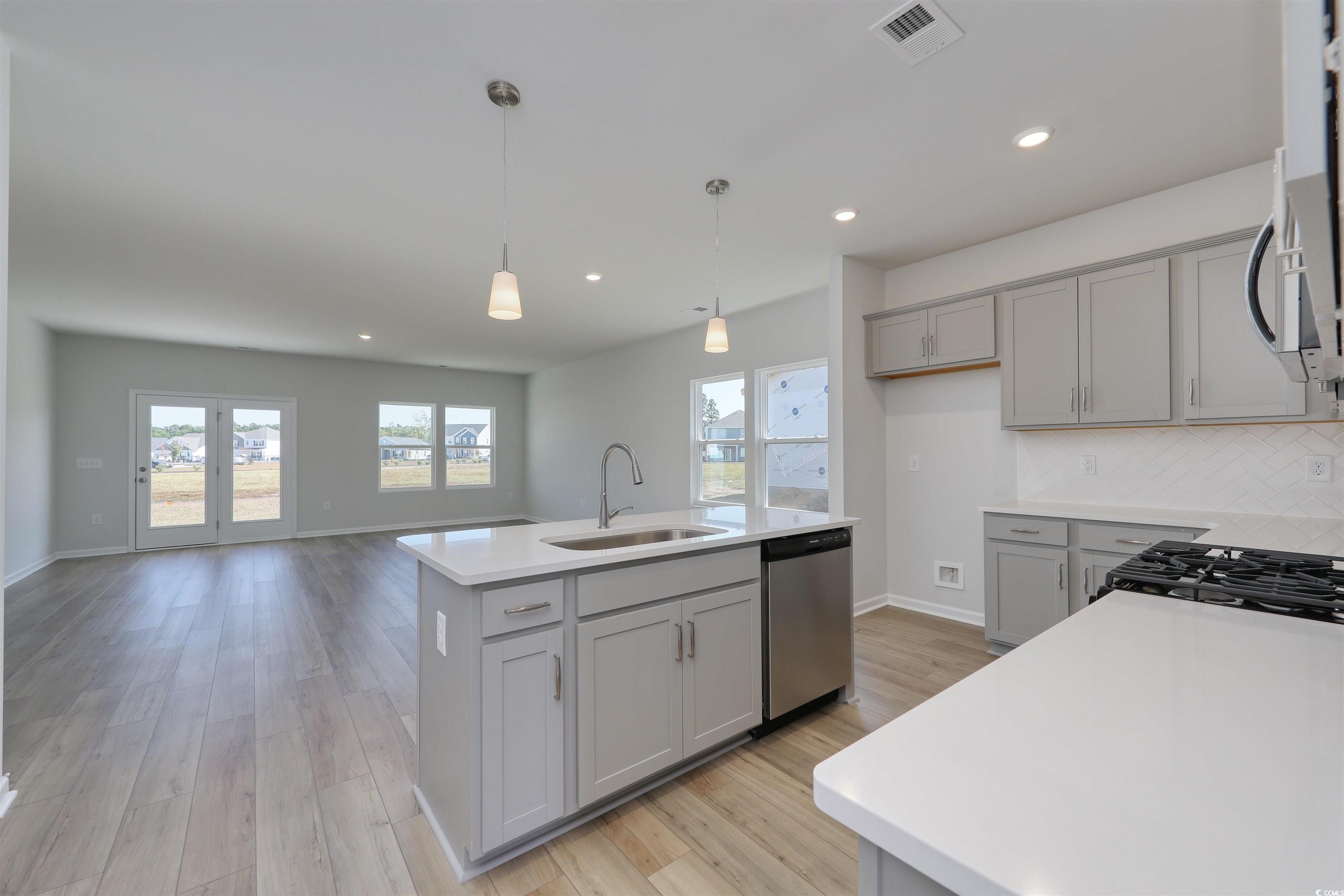 712 St Albans Loop Conway, SC 29526 - Photo 3 of 39 Kitchen with a center island with sink, stainless