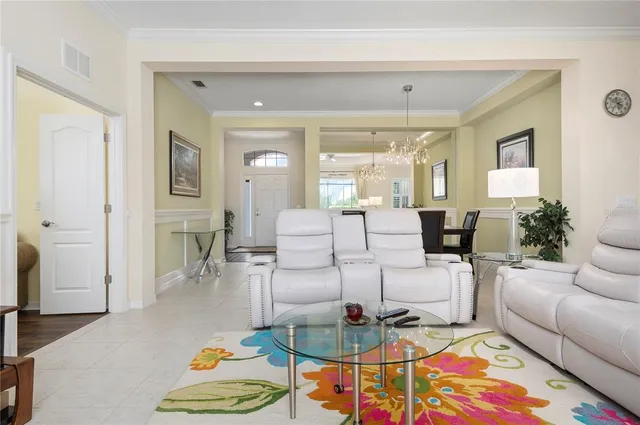 a living room with furniture and a table