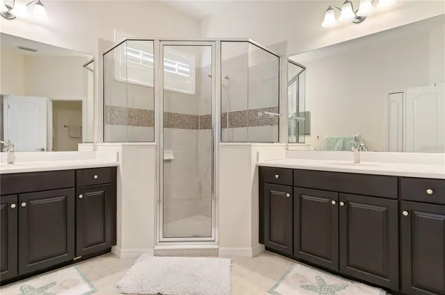 a bathroom with a double vanity sink mirror and double