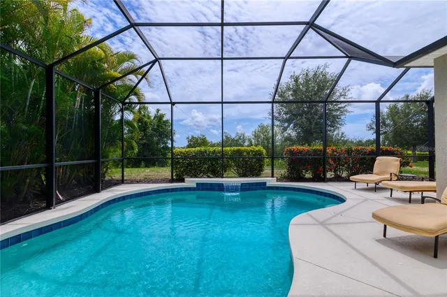 a view of a patio with a table chairs and a garden