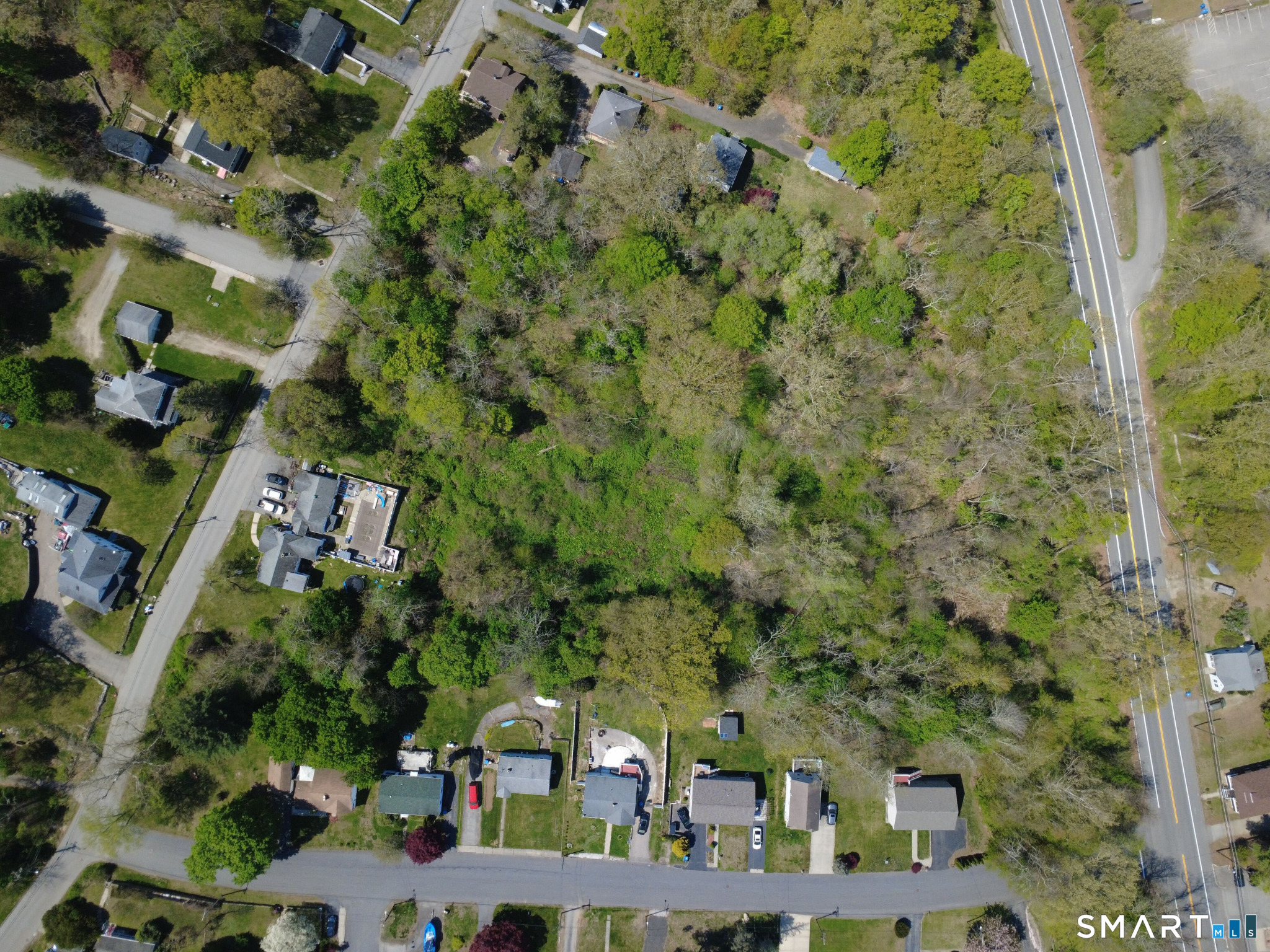84 Corning Road Norwich, CT 06360 - Photo 7 of 12 an aerial view of houses with yard
