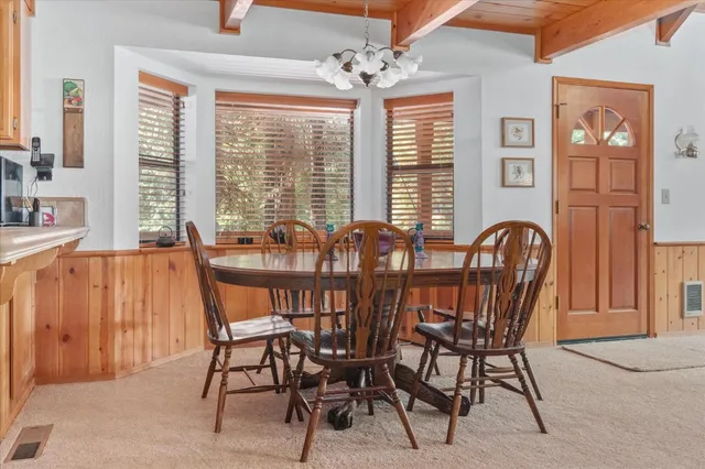 a kitchen with stainless steel appliances granite countertop a refrigerator a sink a stove a microwave and island