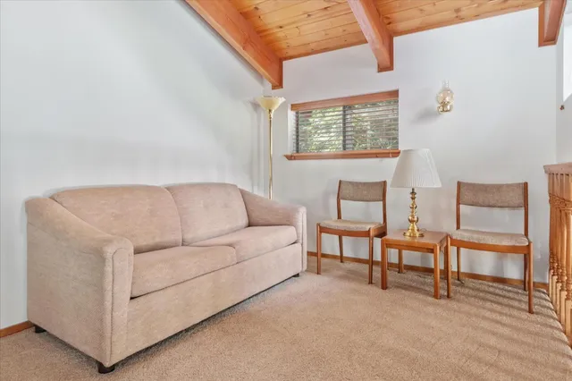 a bedroom with a bed and a table