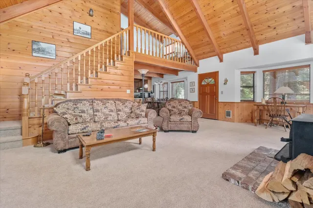 a view of a livingroom with a lounge chair and a window