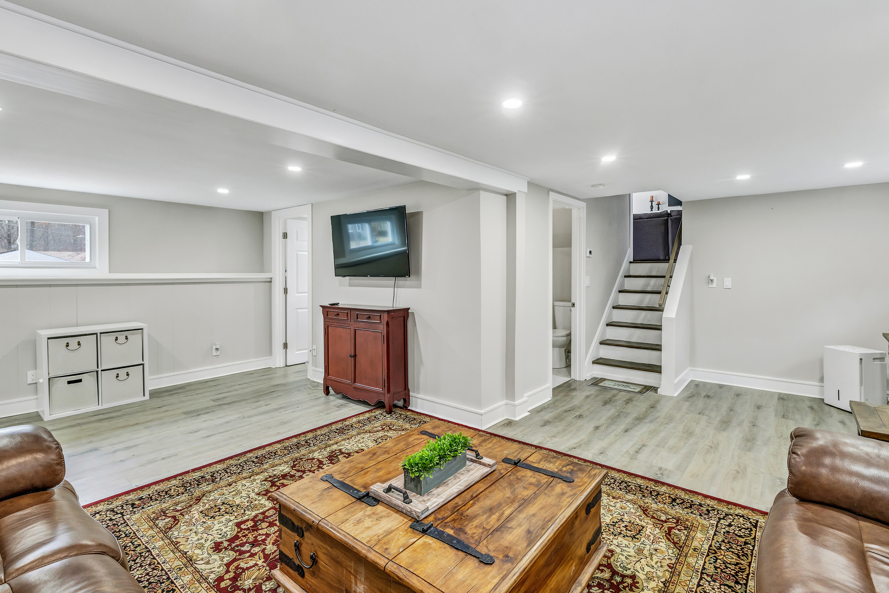 13 School Street Monroe, CT 06468 - Photo 19 of 29 a living room with furniture and a flat screen tv