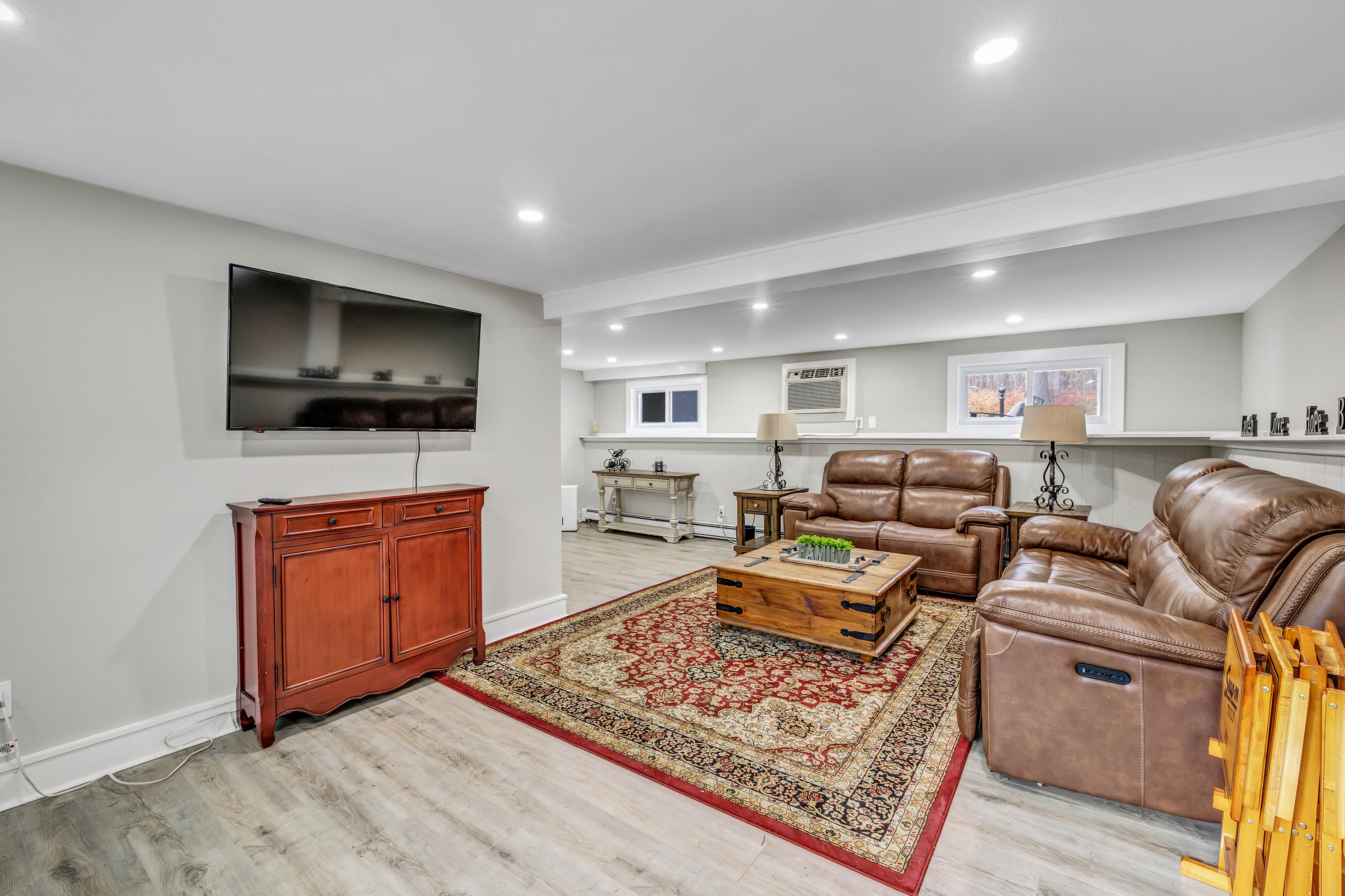13 School Street Monroe, CT 06468 - Photo 20 of 29 a living room with furniture and a flat screen tv