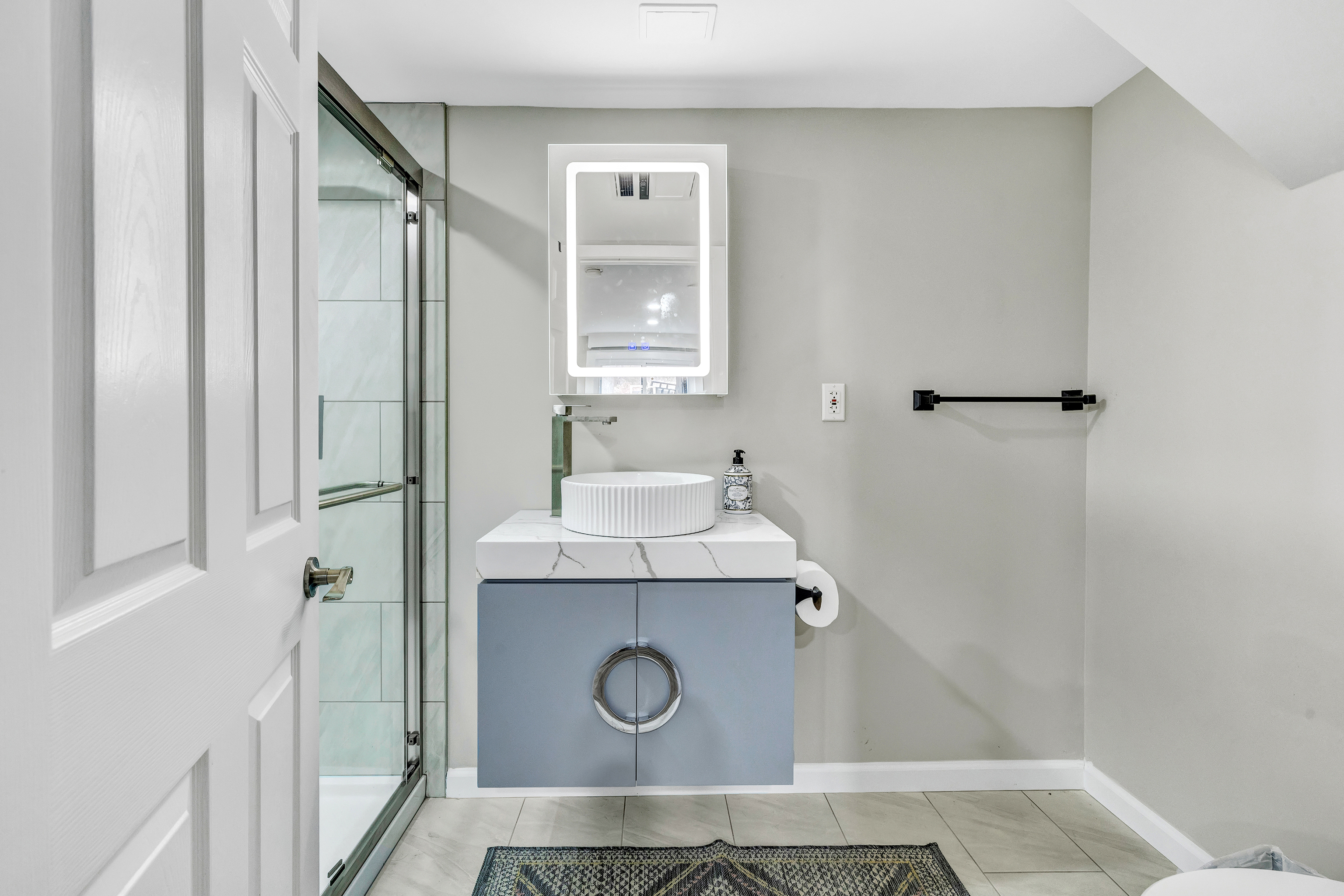 13 School Street Monroe, CT 06468 - Photo 24 of 29 a bathroom with a sink a toilet and mirror