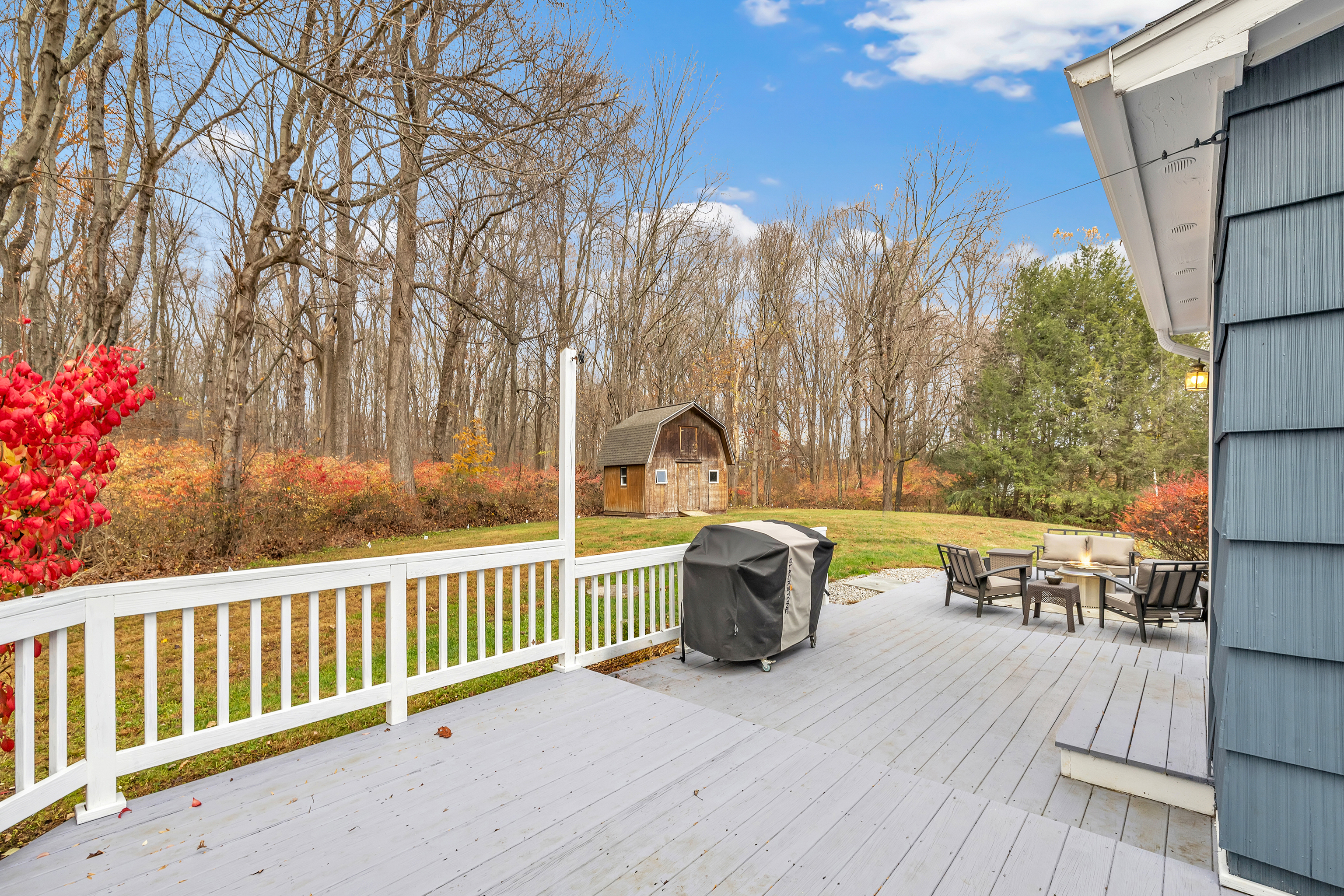 13 School Street Monroe, CT 06468 - Photo 29 of 29 a view of a chair and table on the wooden deck