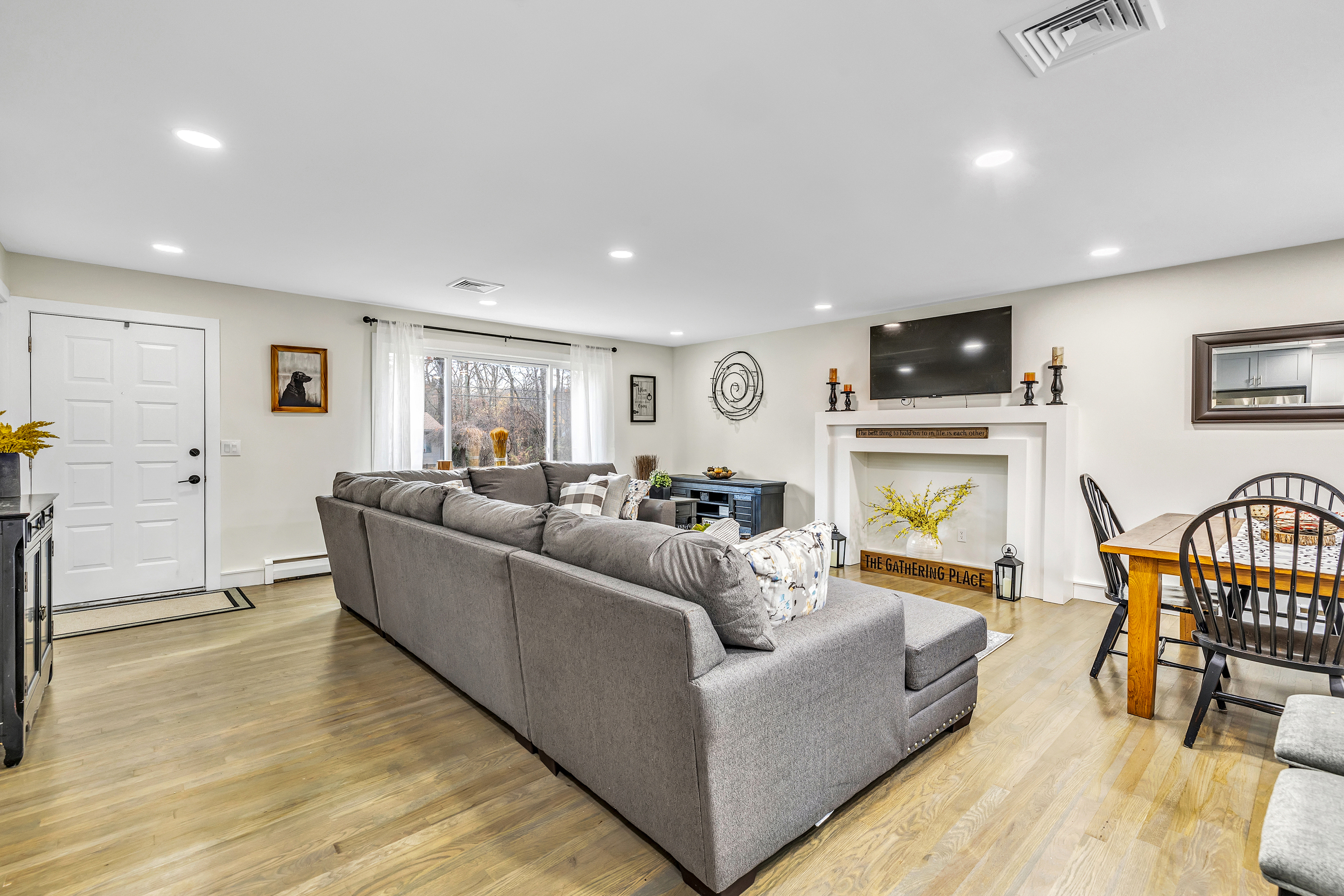 13 School Street Monroe, CT 06468 - Photo 9 of 29 a living room with furniture and a flat screen tv